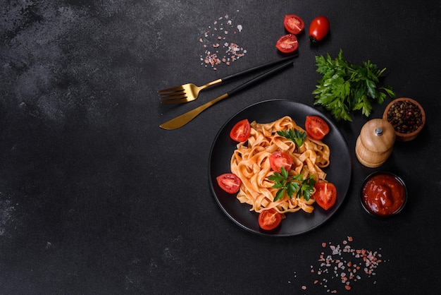 Tasty appetizing pasta tagliatelle spaghetti with tomato sauce and parmesan