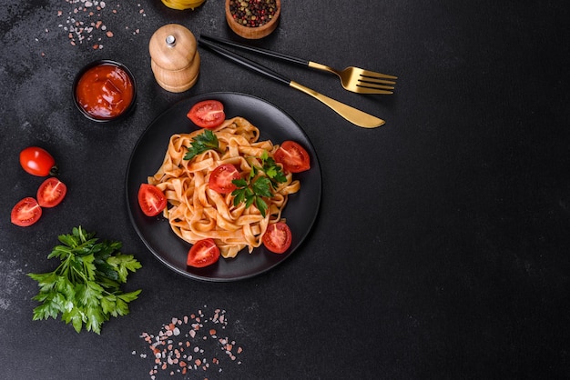 Tasty appetizing pasta tagliatelle spaghetti with tomato sauce and parmesan