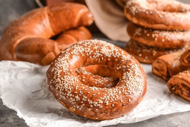 Tasty bagels on table