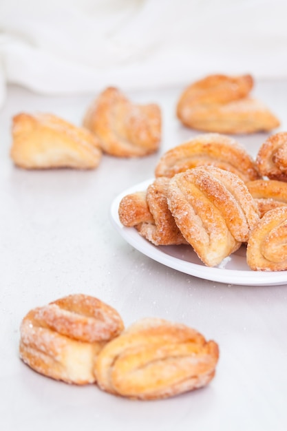 Tasty baked butter sugar cookies on white background.