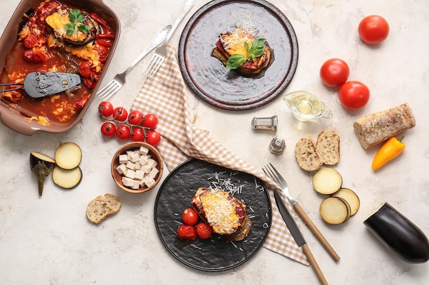 Tasty baked vegetables on light background