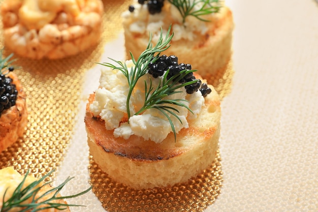 Tasty black caviar appetizer on plate