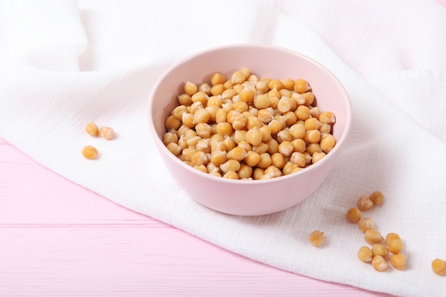 Tasty boiled chickpeas on the table closeup