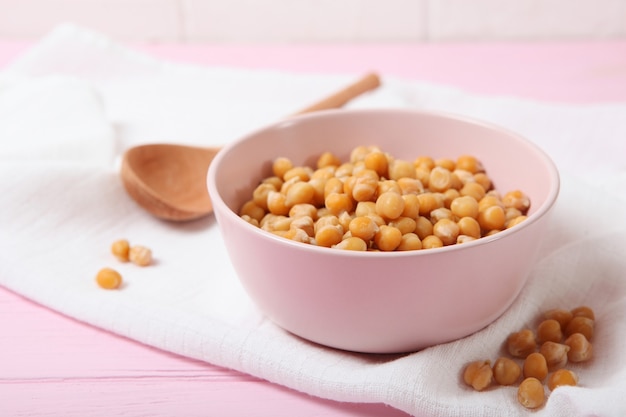 Tasty boiled chickpeas on the table closeup