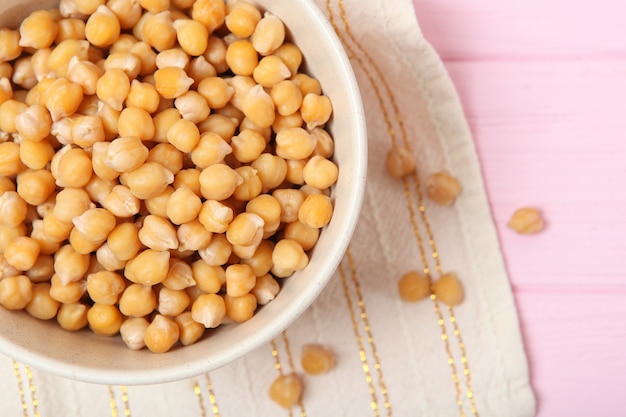 Tasty boiled chickpeas on the table closeup