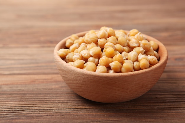 Tasty boiled chickpeas on the table closeup