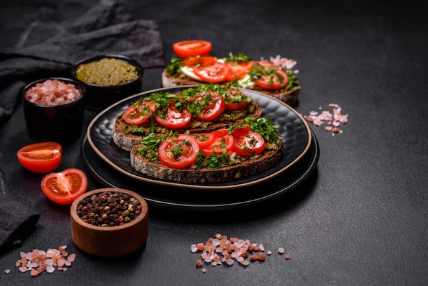 Tasty bruschetta with tomatoes mozzarella basil spices and herbs