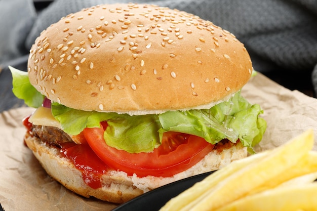 Tasty burger closeup home made beef burger with tomato cheese beef and salad