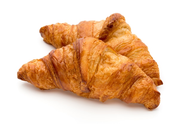 Tasty buttery croissants on the white background