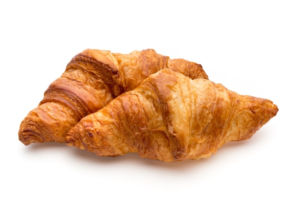 Tasty buttery croissants on the white background