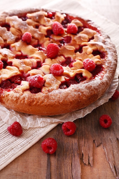 Tasty cake with berries on table closeup