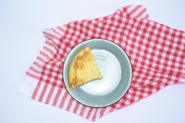 Tasty cake with egg yolk on a white background