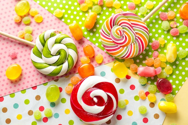 Tasty candies on colorful background