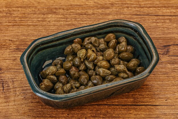 Tasty capers in the bowl