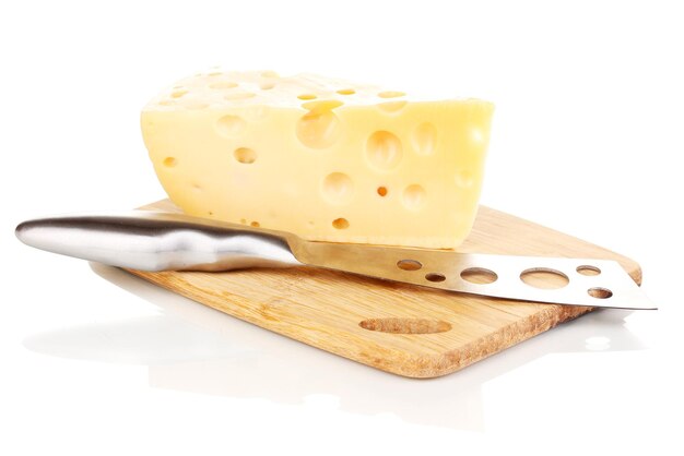 Tasty cheese and knife on wooden board isolated on white