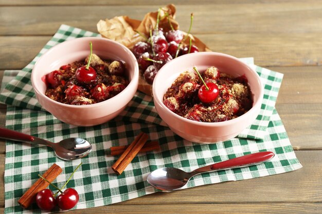 Tasty cherry dessert on table