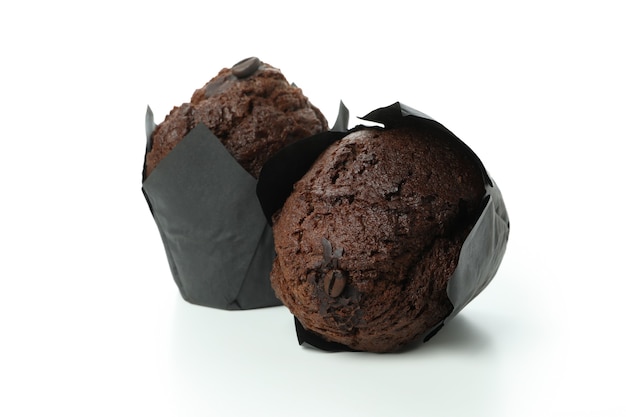 Tasty chocolate muffins isolated on white background.