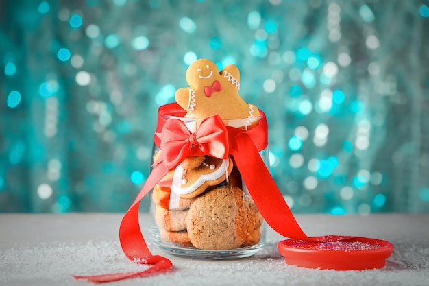 Tasty Christmas homemade cookies in jar on blurred background