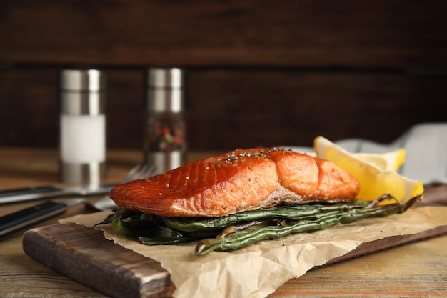 Tasty cooked salmon and vegetables served on wooden table Healthy meals from air fryer