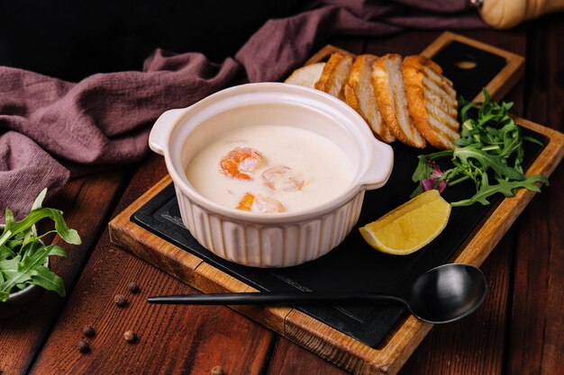 Tasty cream soup with shrimp in bowl