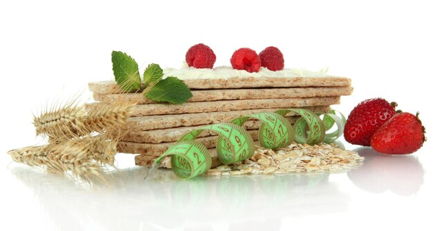 Tasty crispbread with berries isolated on white