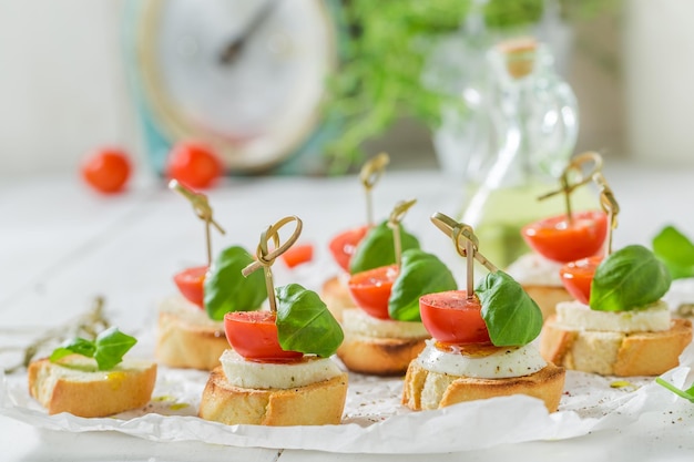 Tasty crostini with tomato mozzarella and basil for a snack