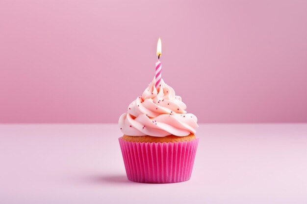 Tasty cupcake decorated with candle on pink