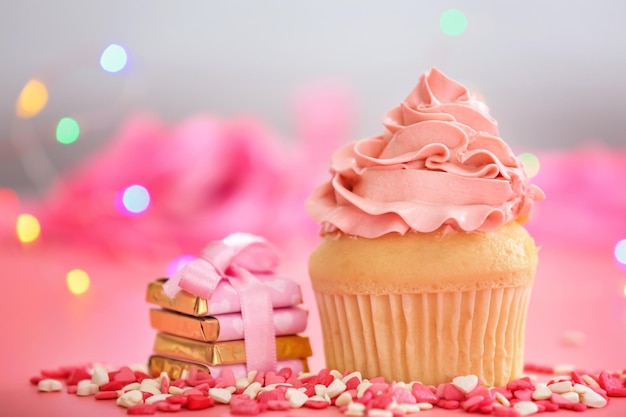 Tasty cupcake for Valentine's Day on pink table