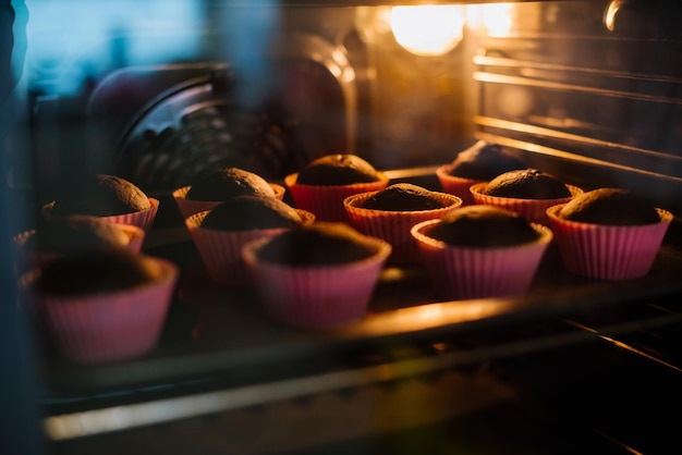 Tasty cupcakes baking in the oven