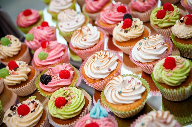 Tasty cupcakes on a white wooden table