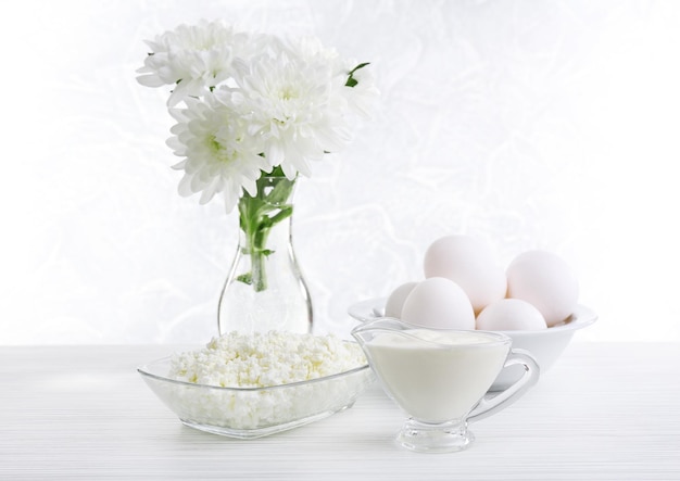 Tasty dairy products on wooden table