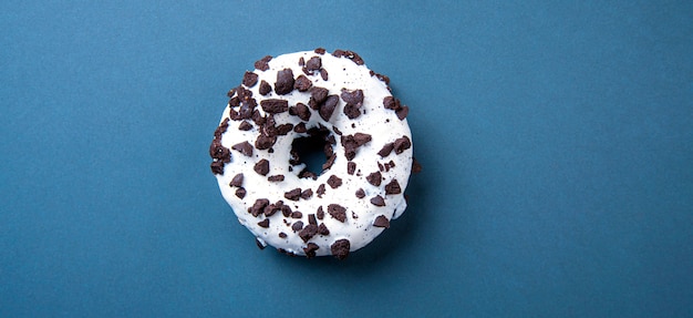 Tasty donut on blue background