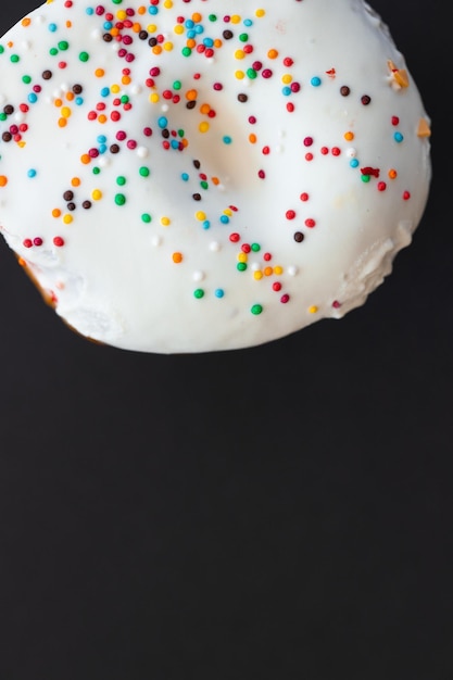 Tasty donuts on black background