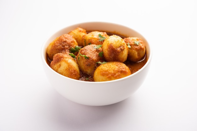 Tasty Dum Aloo or whole potatoes spicy curry is a popular main course recipe from India