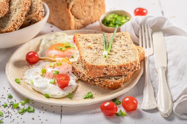 Tasty and fresh breakfast with bread and fried eggs