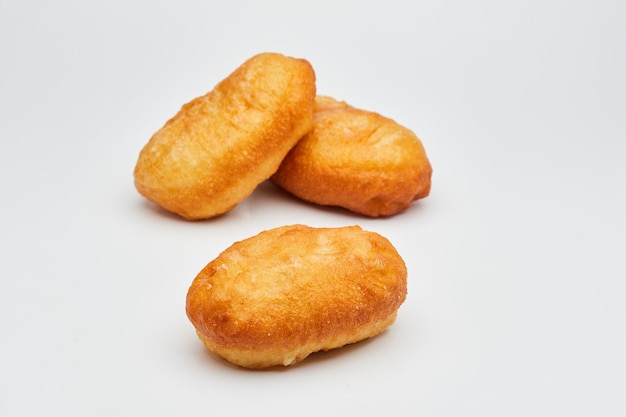 Tasty fried donuts isolated on white background Unhealthy food Studio shoot