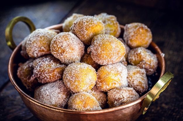 Tasty fried dumpling with sugar and cinnamon, typical of Brazil