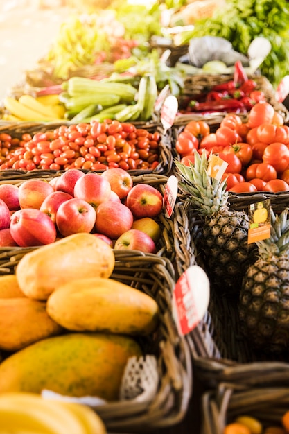 Tasty fruit and fresh organic vegetable arrange in row at market store