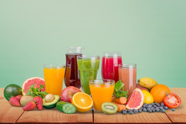 Tasty fruits  and juice with vitamins on background