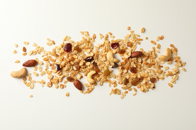 Tasty granola on white background, top view