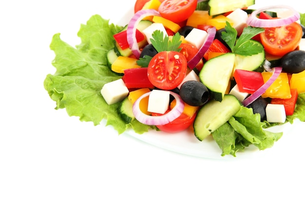 Tasty Greek salad isolated on white