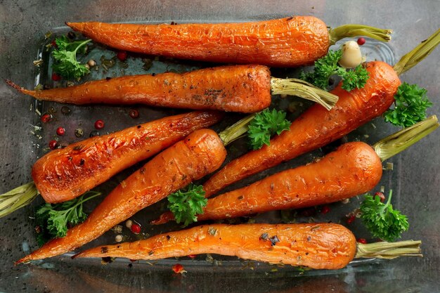 Tasty grilled carrots in glass bowl