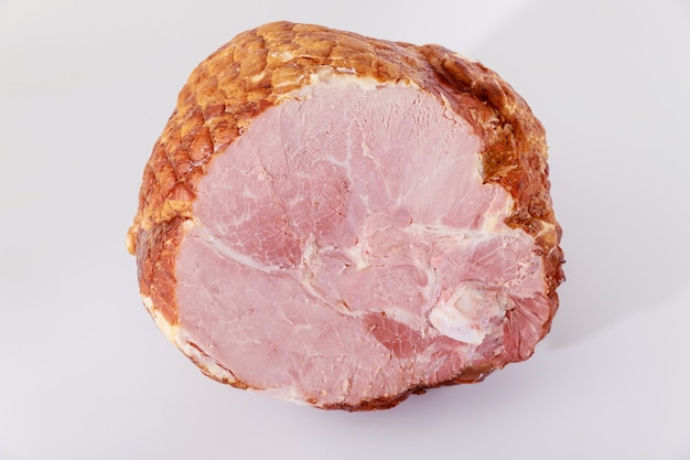 Tasty honey smoked pork ham on white isolated background.