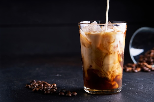 Tasty ice coffee with milk