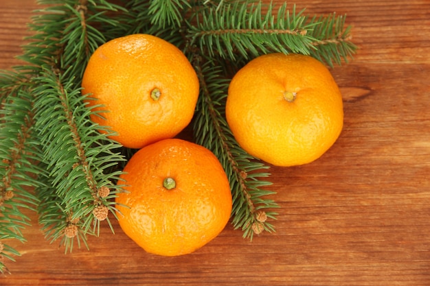 Tasty mandarines on wooden background