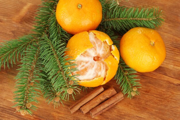 Tasty mandarines on wooden background