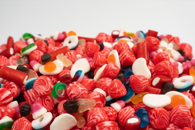 Tasty mix of jelly colorful candies isolated on a white background