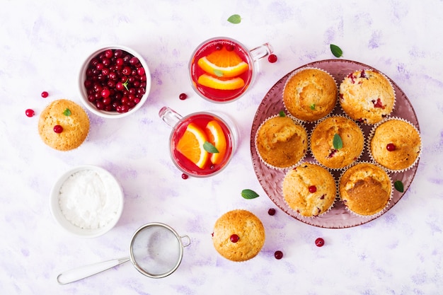 Tasty muffin (cupcake) with cranberries. Top view