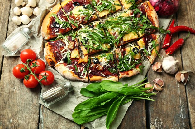 Tasty pizza with vegetables on table close up