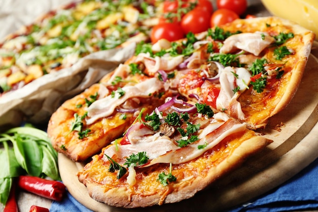 Tasty pizza with vegetables on table close up